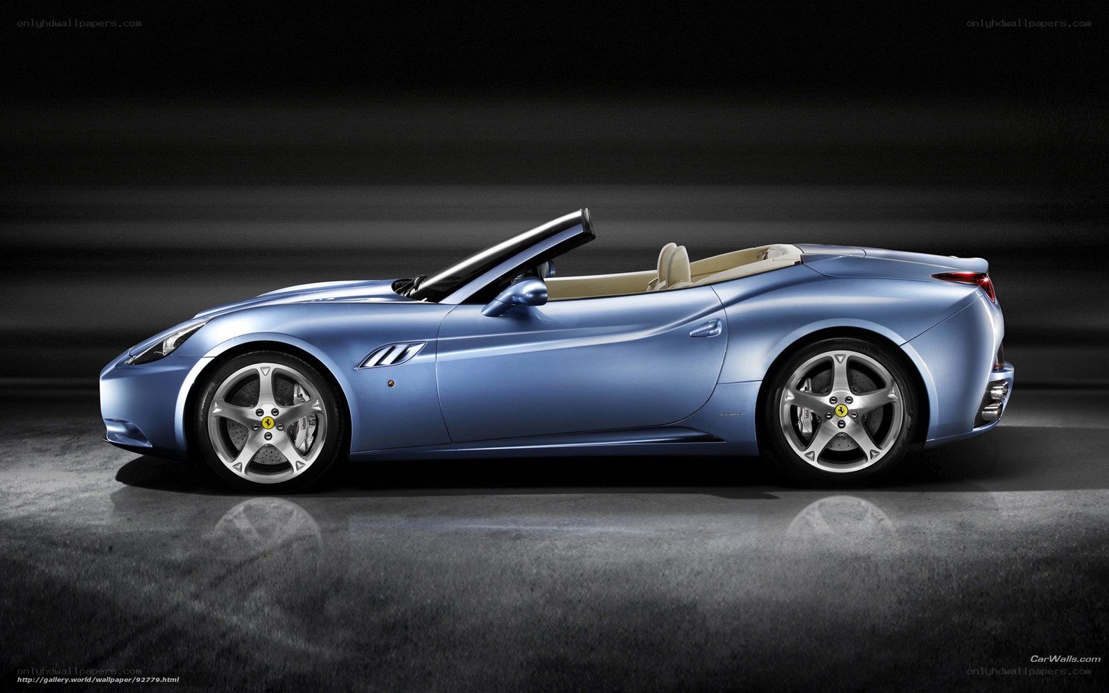 blue ferrari convertible sports car