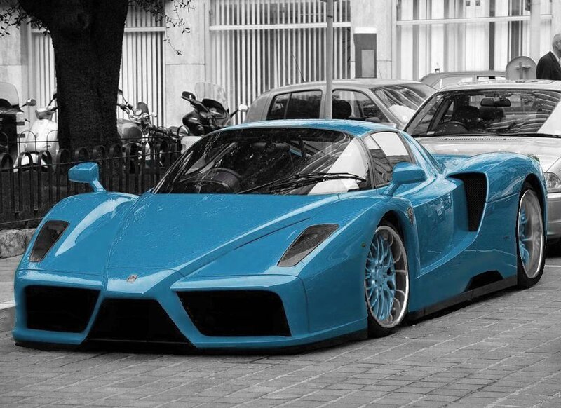 Blue Ferrari Enzo parked on street