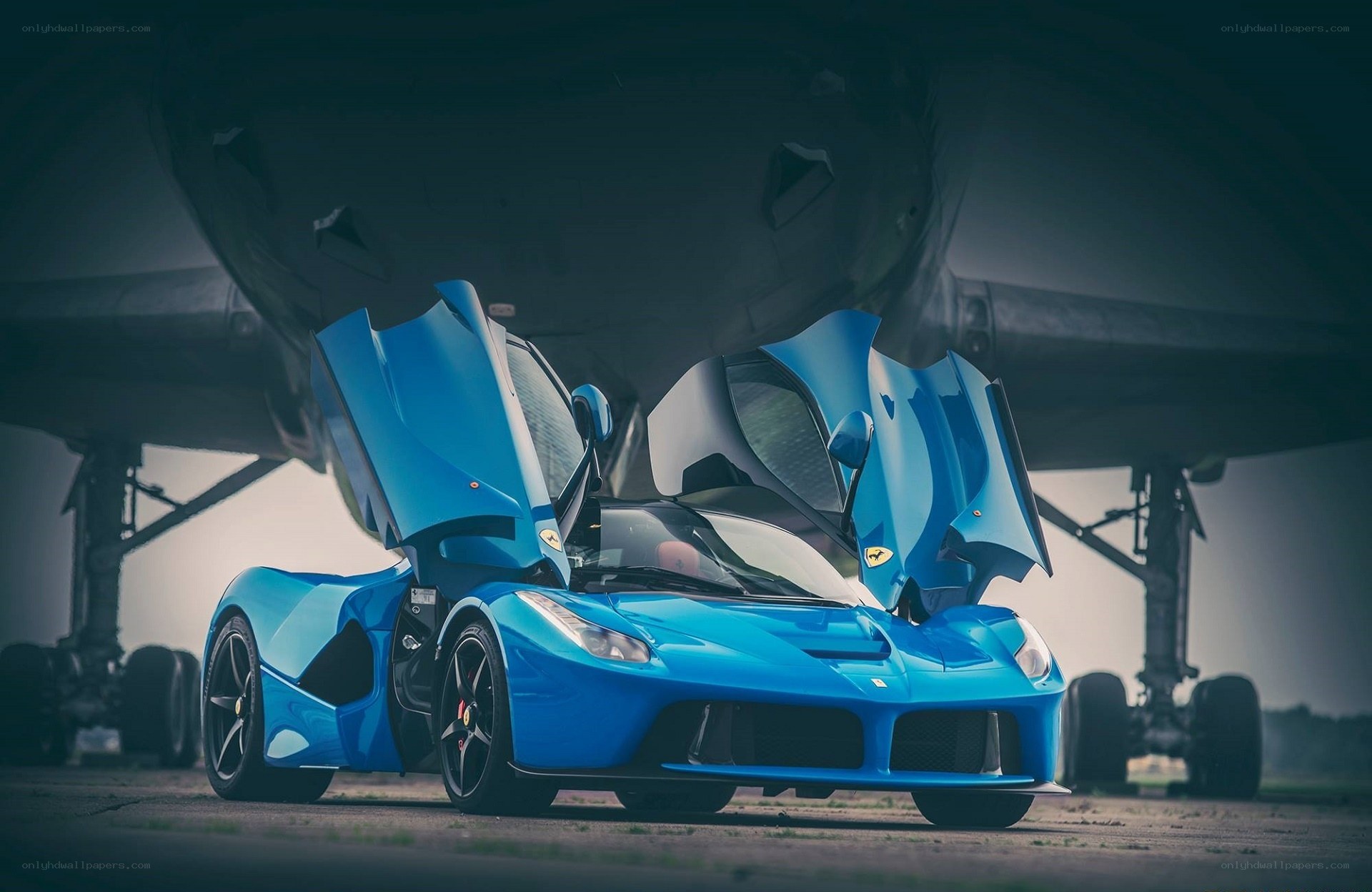 Blue Ferrari LaFerrari under aircraft