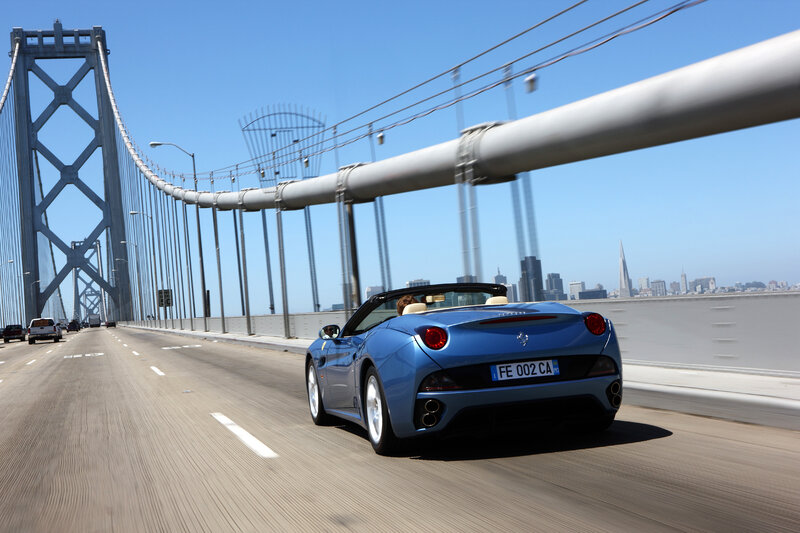 Blue Ferrari on a bridge