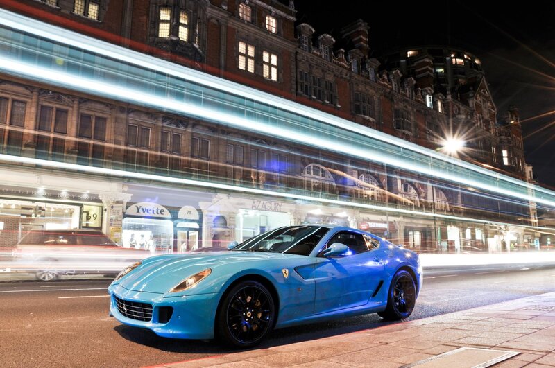 Blue Ferrari on a city street