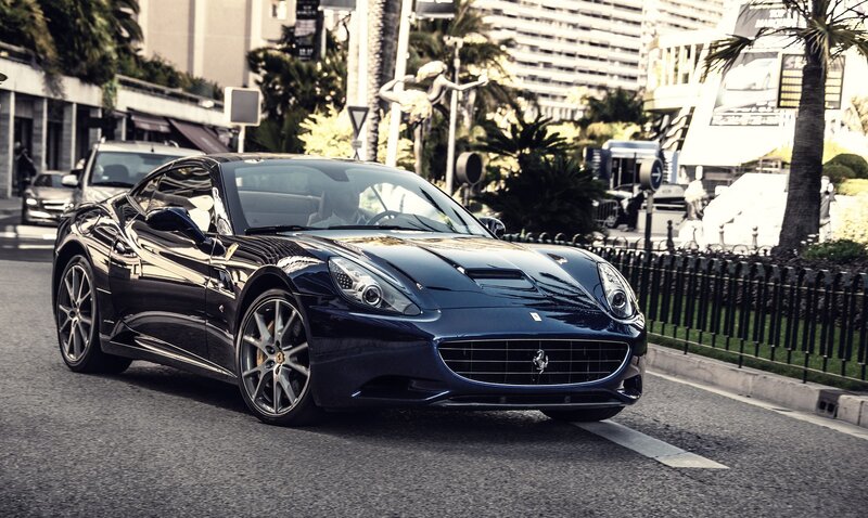 Blue Ferrari on city street