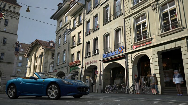Blue Ferrari on city street