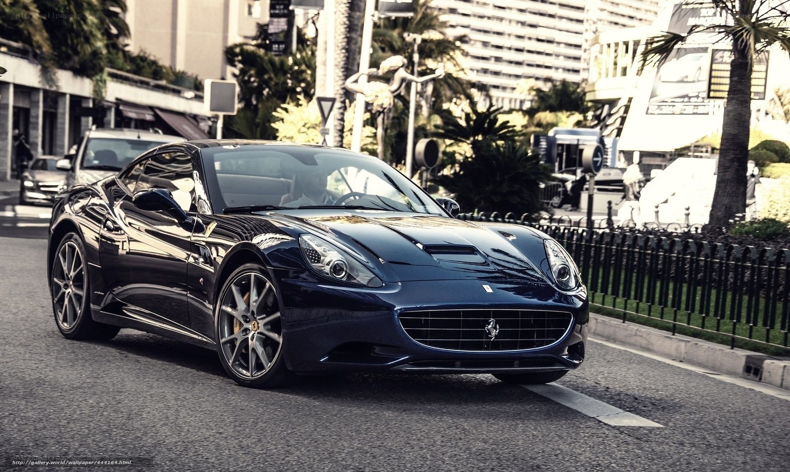 Blue Ferrari on city street