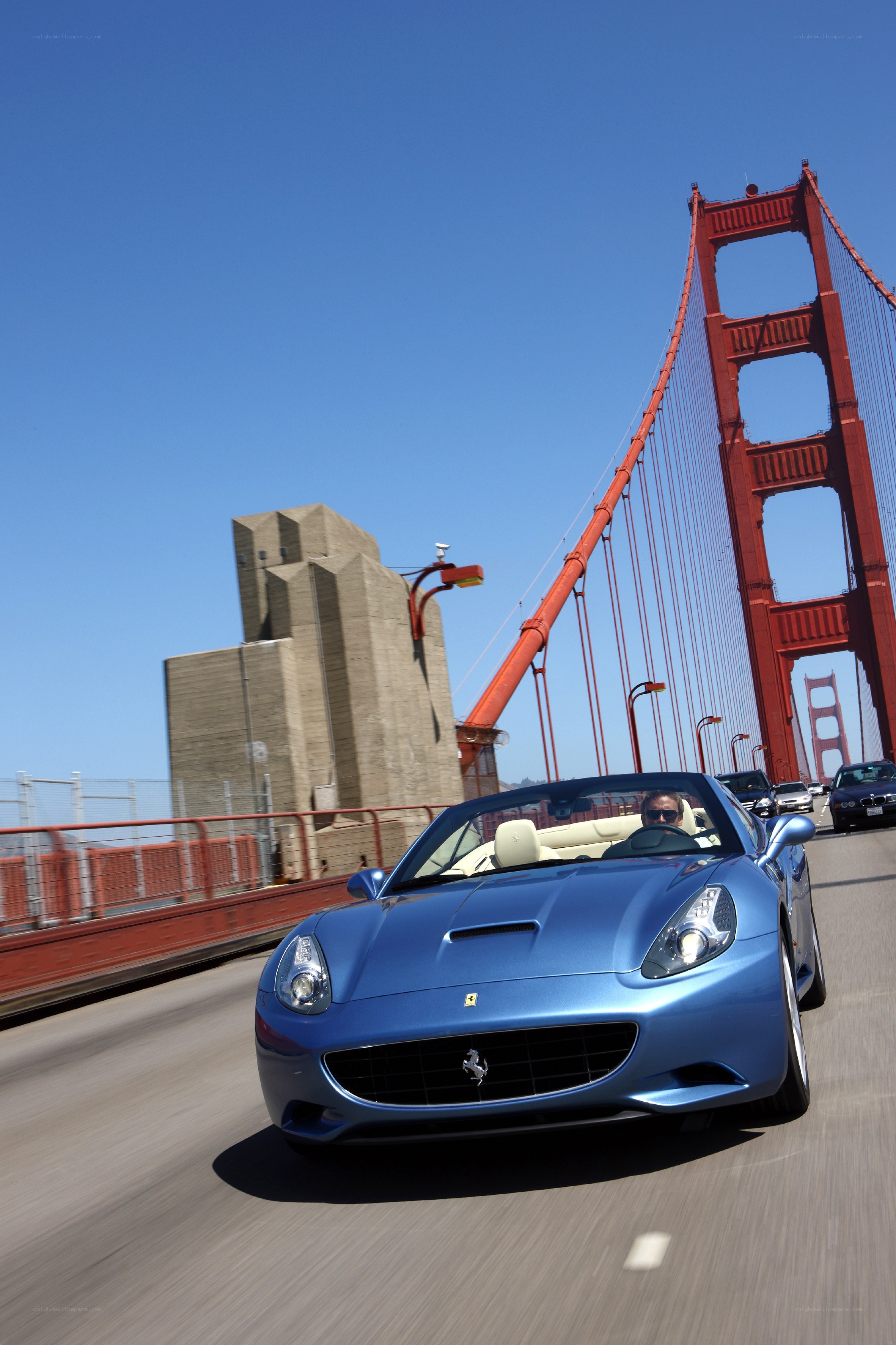 Blue Ferrari on Golden Gate Bridge