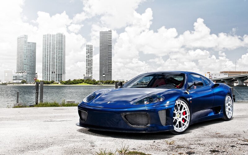 Blue Ferrari on waterfront