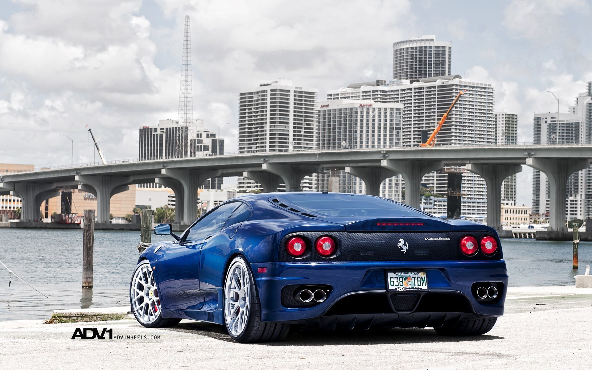 Blue Ferrari on waterfront