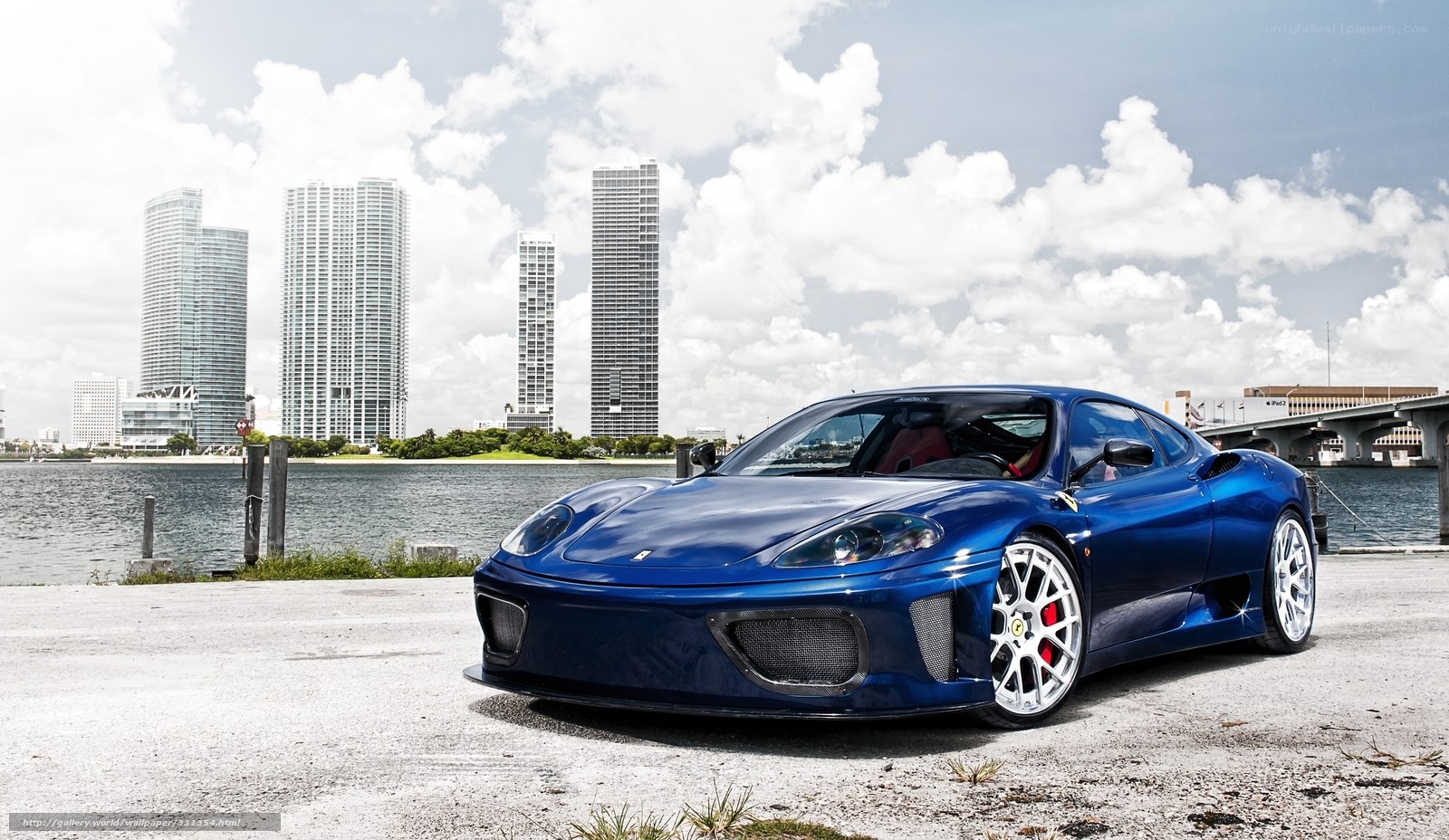 Blue Ferrari on waterfront