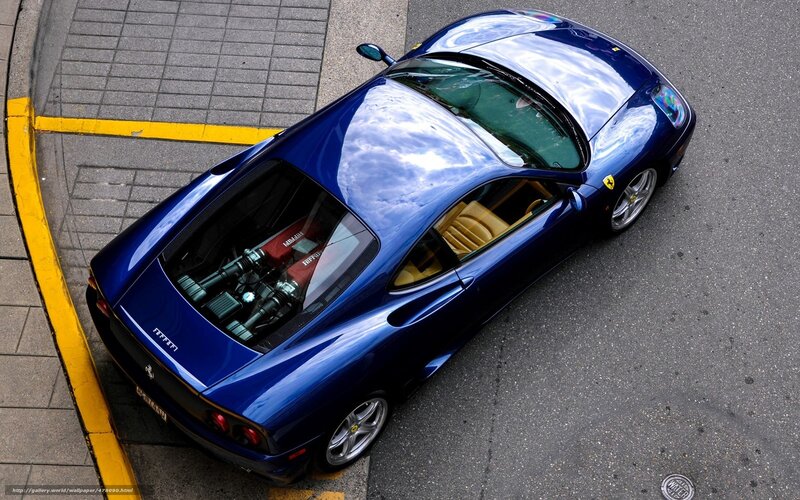 Blue Ferrari parked on street
