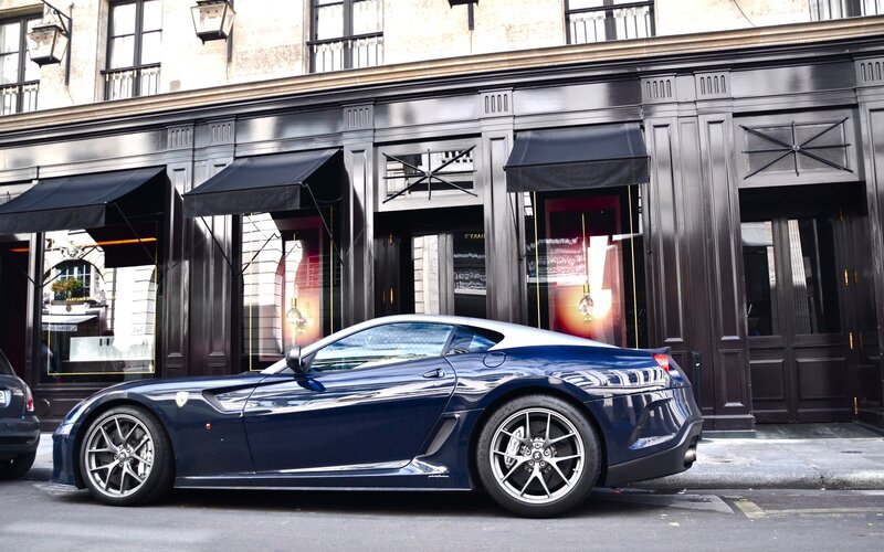 Blue Ferrari parked on street