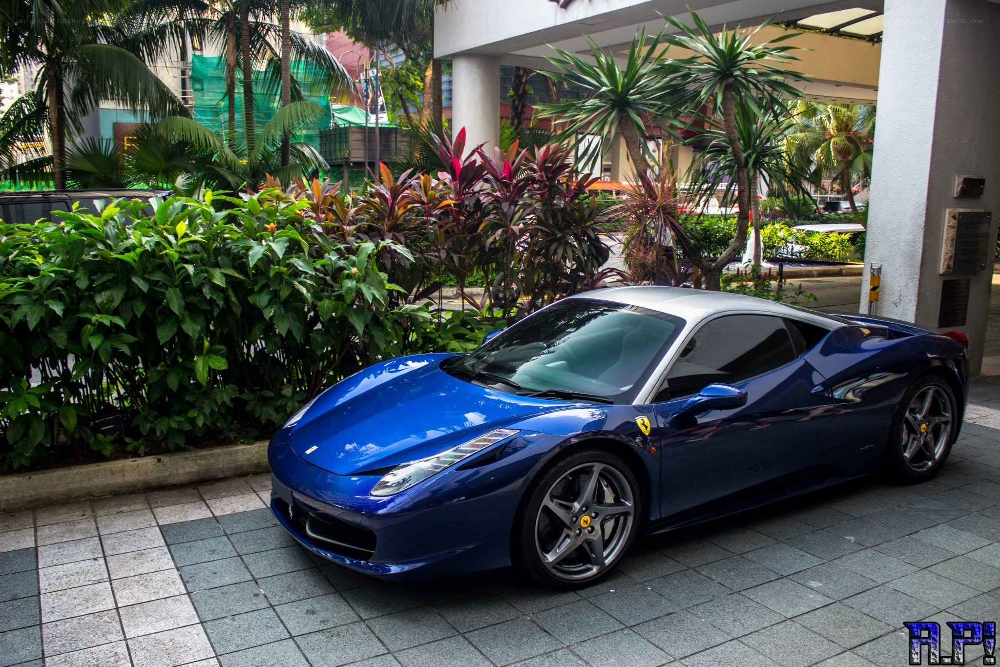 Blue Ferrari parked outside