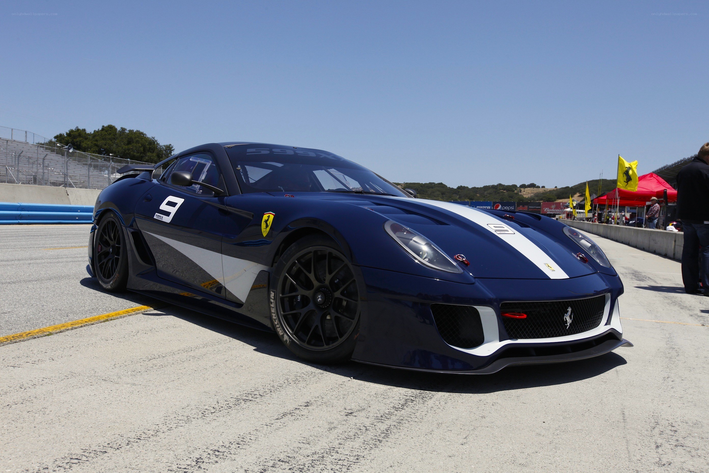 Blue Ferrari race car on track