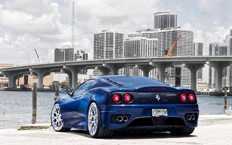 Blue Ferrari Sports Car — Urban, Afternoon, Photograph, Bridge, City Skyline
