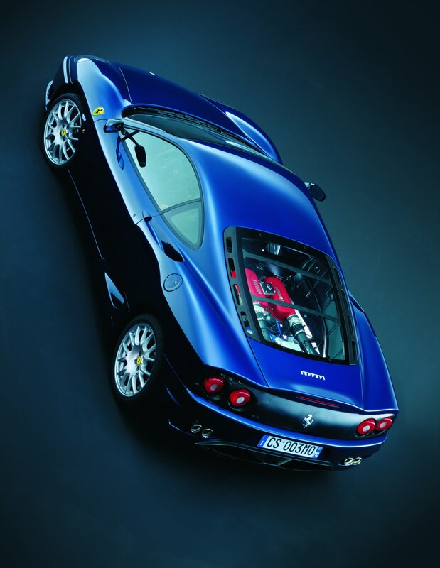 Blue Ferrari with engine view