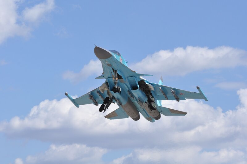 Blue Fighter Jet — Dynamic, Afternoon, Photograph, Clouds