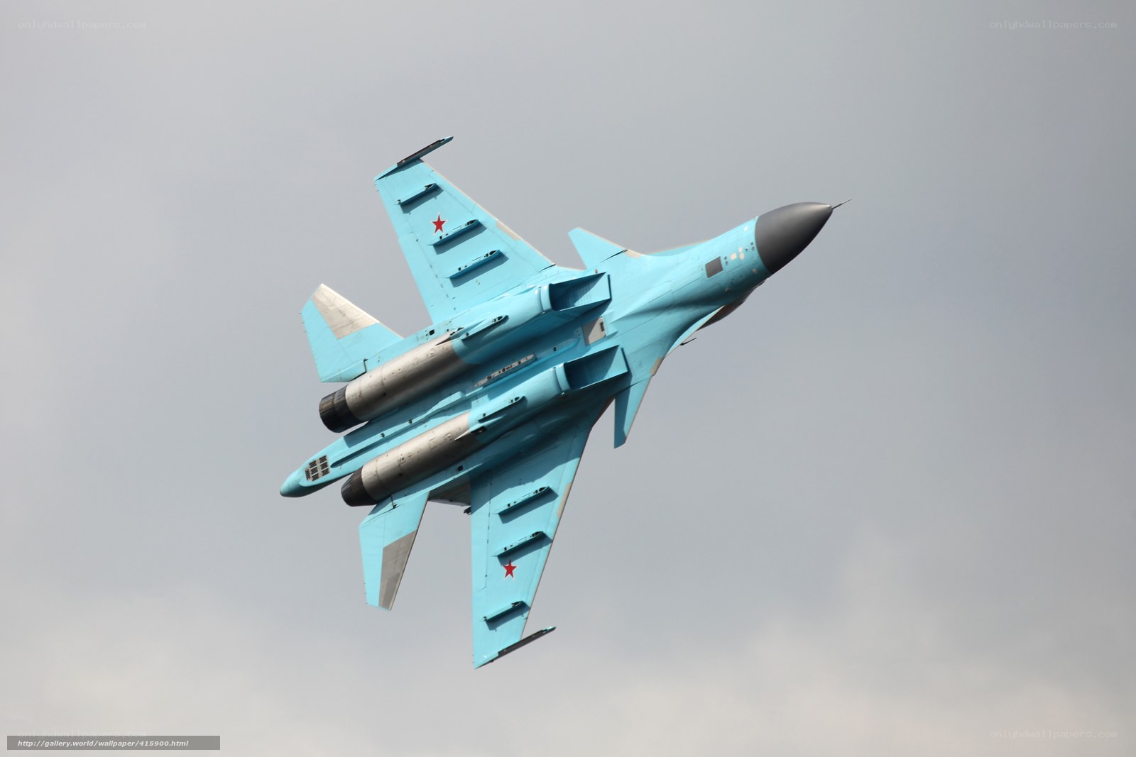 Blue fighter jet in flight