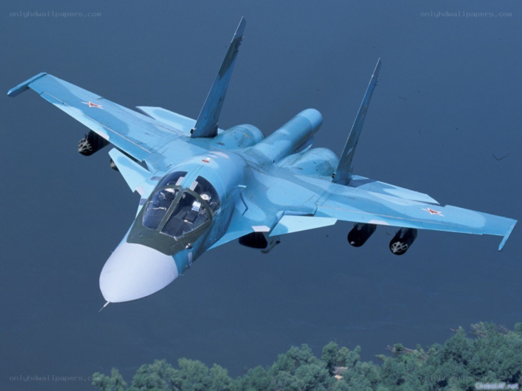Blue fighter jet in flight