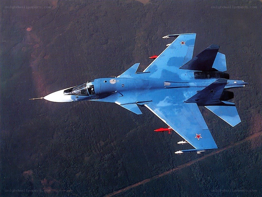 Blue fighter jet in flight