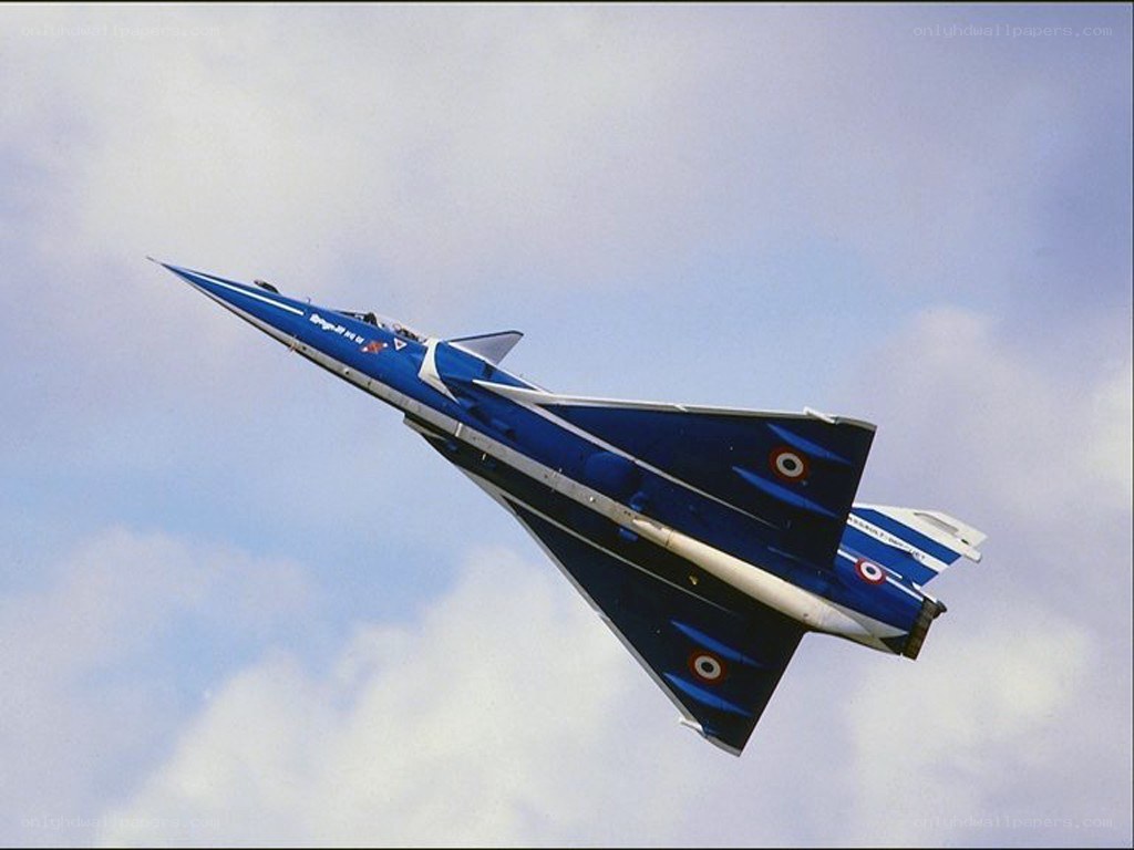 blue fighter jet in flight