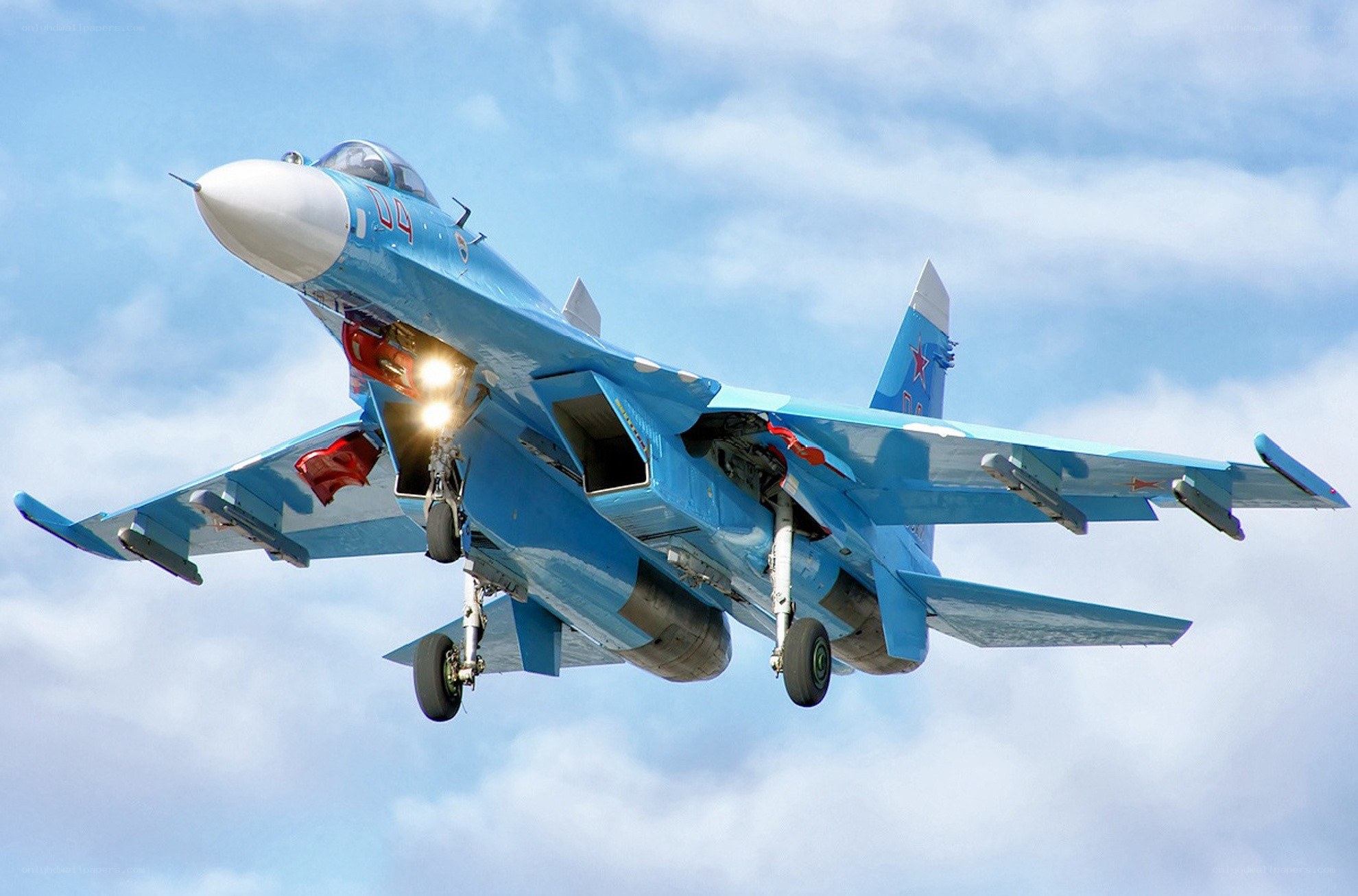 Blue fighter jet in flight