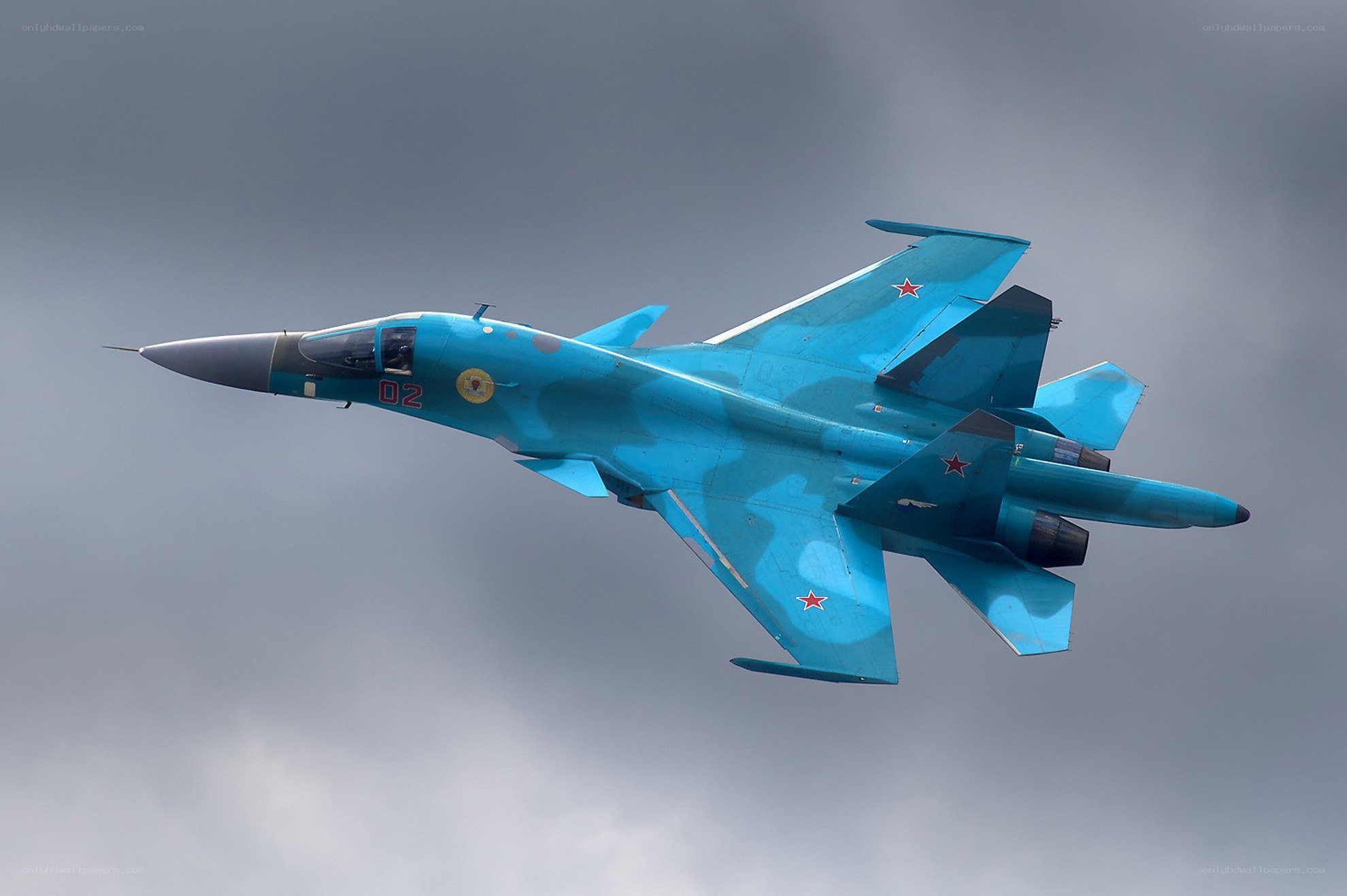 Blue fighter jet in flight