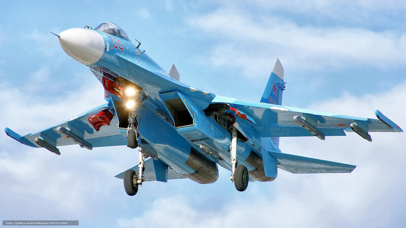 Blue fighter jet in flight