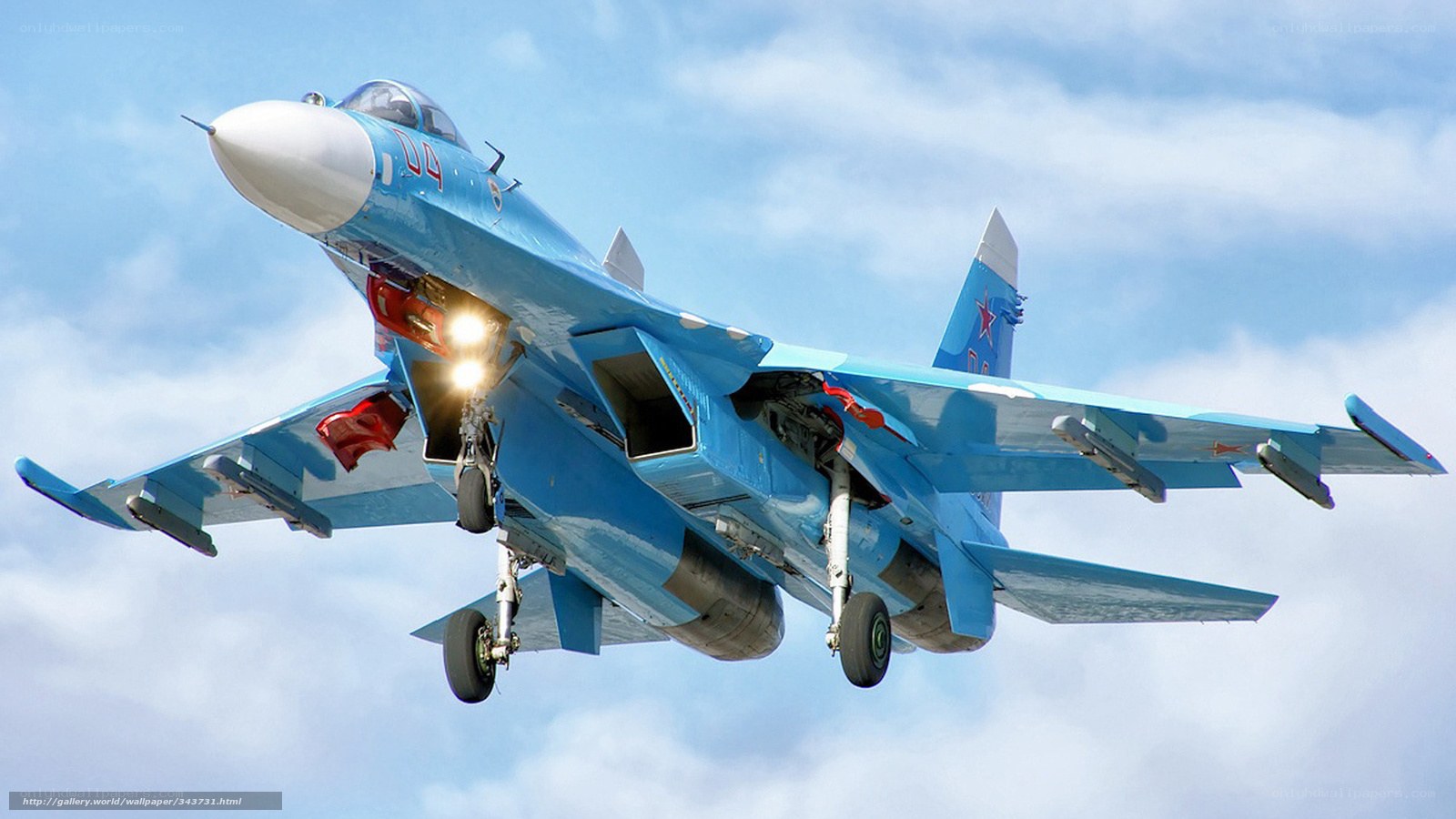 Blue fighter jet in flight