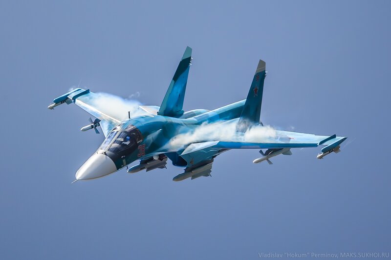 Blue Fighter Jet in Flight — Dynamic, Afternoon, Photograph, Smoke