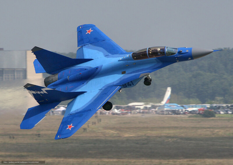 Blue Fighter Jet in Flight — Dynamic, Afternoon, Photograph