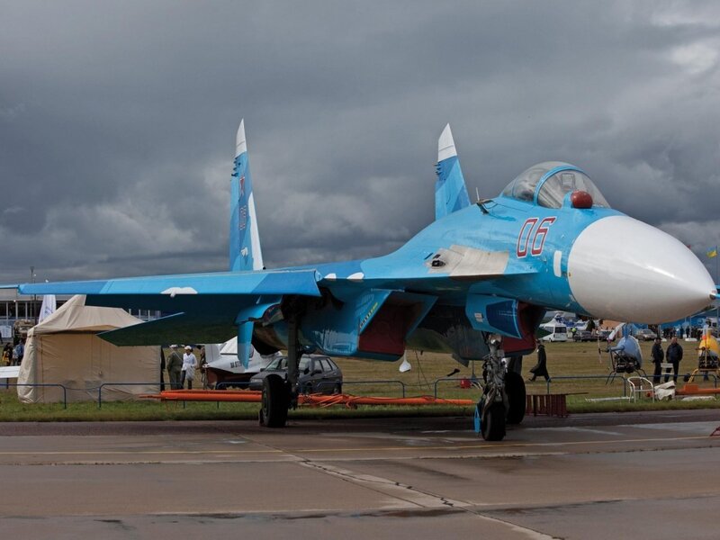 Blue fighter jet on display
