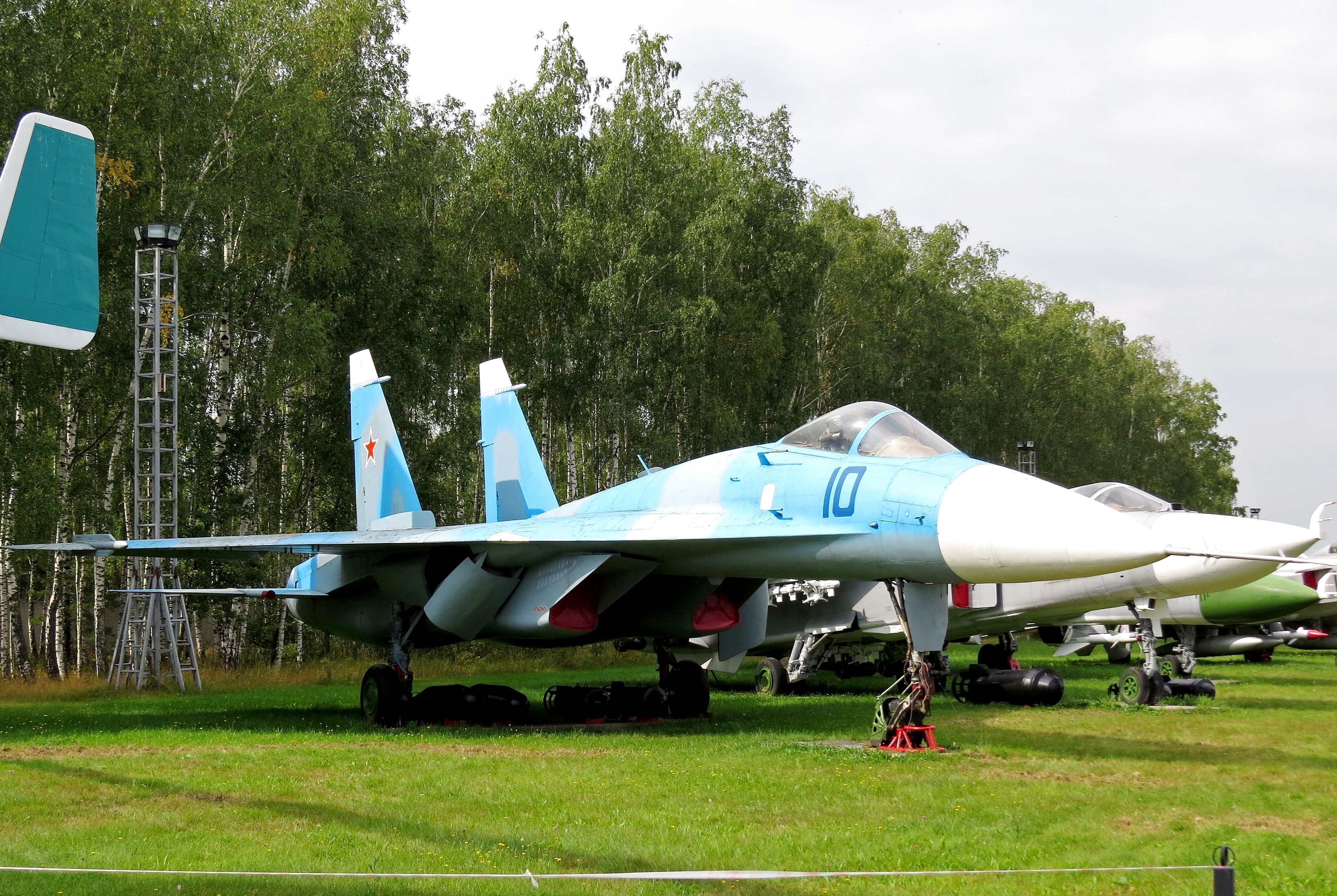 Blue fighter jet on display