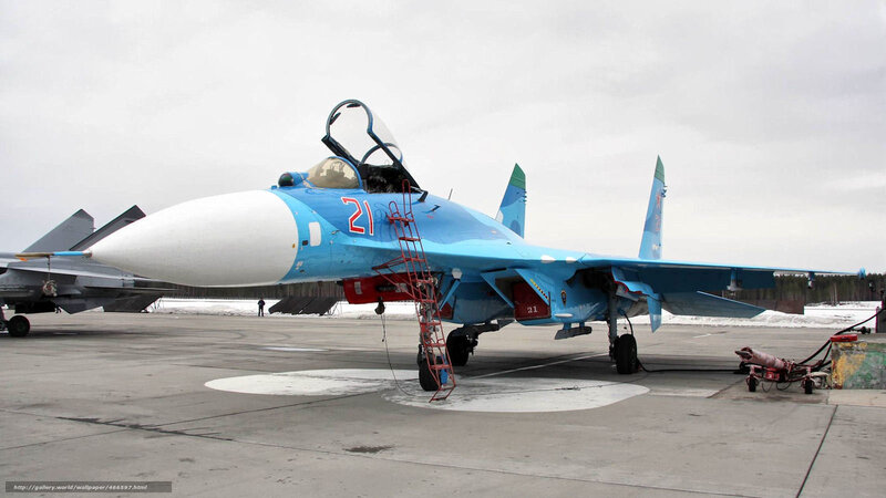 Blue fighter jet on tarmac