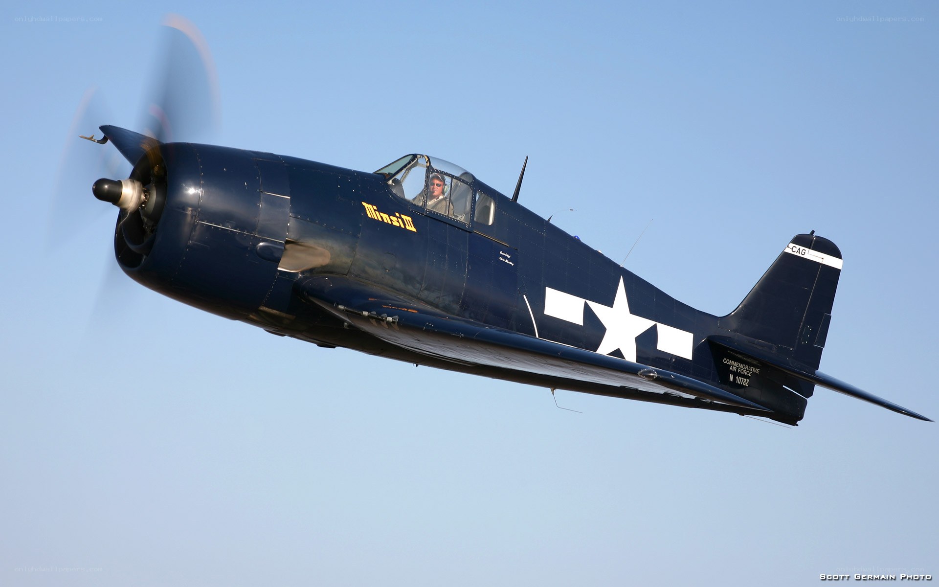 Blue fighter plane in flight