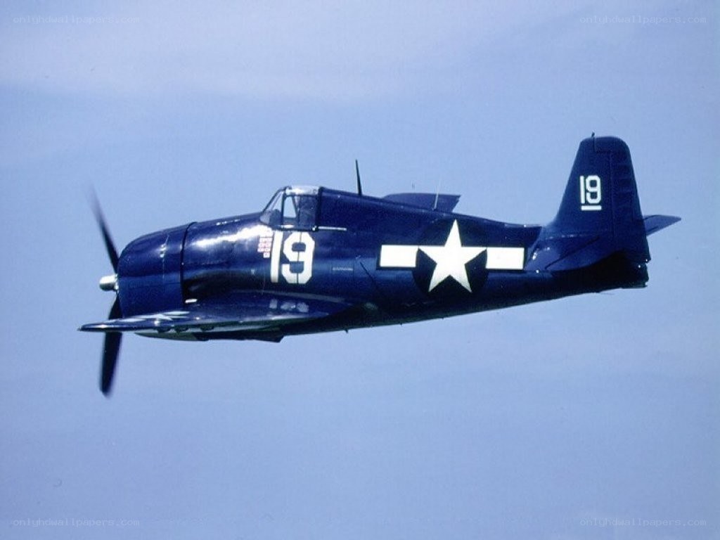 blue fighter plane in flight