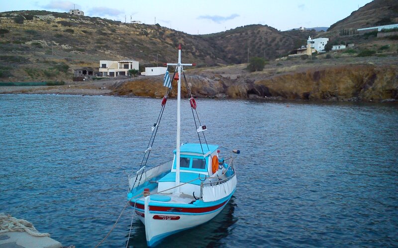 Blue Fishing Boat — Serene, Sunset