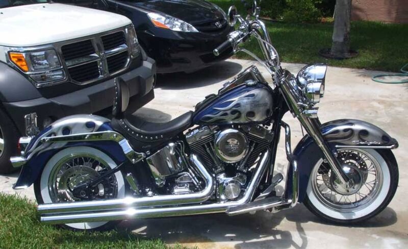 Blue flame motorcycle on driveway
