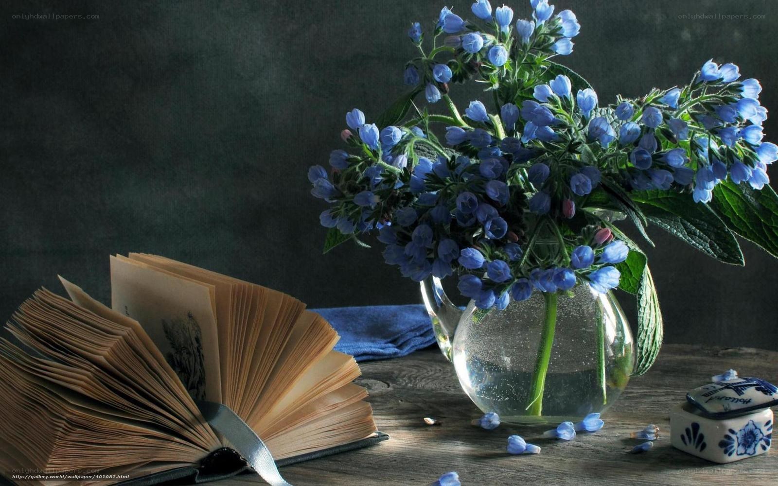 Blue flowers and open book