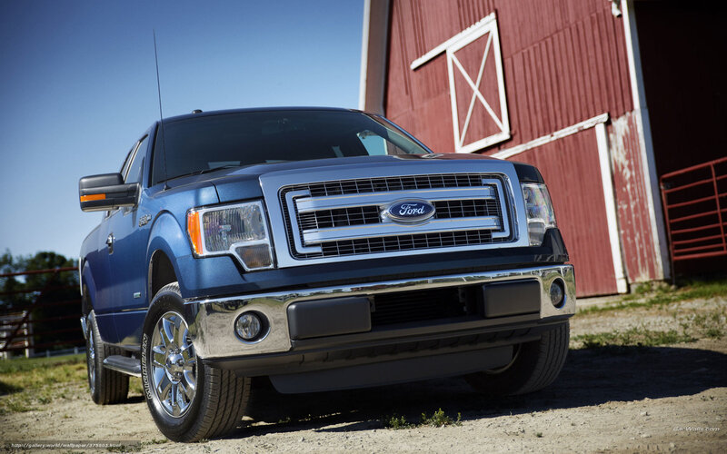 Blue Ford F-150 in front of barn