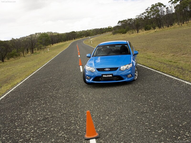 Blue Ford Falcon on a winding road