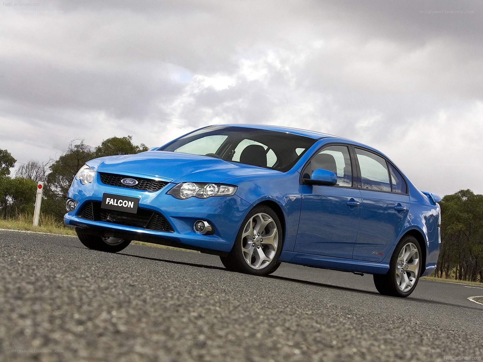 Blue Ford Falcon XR6 on a road