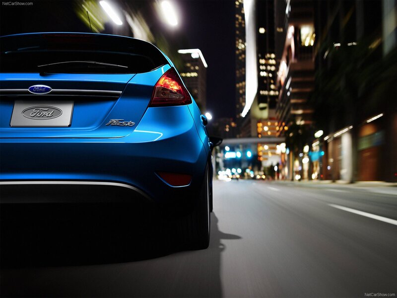 Blue Ford Fiesta at night