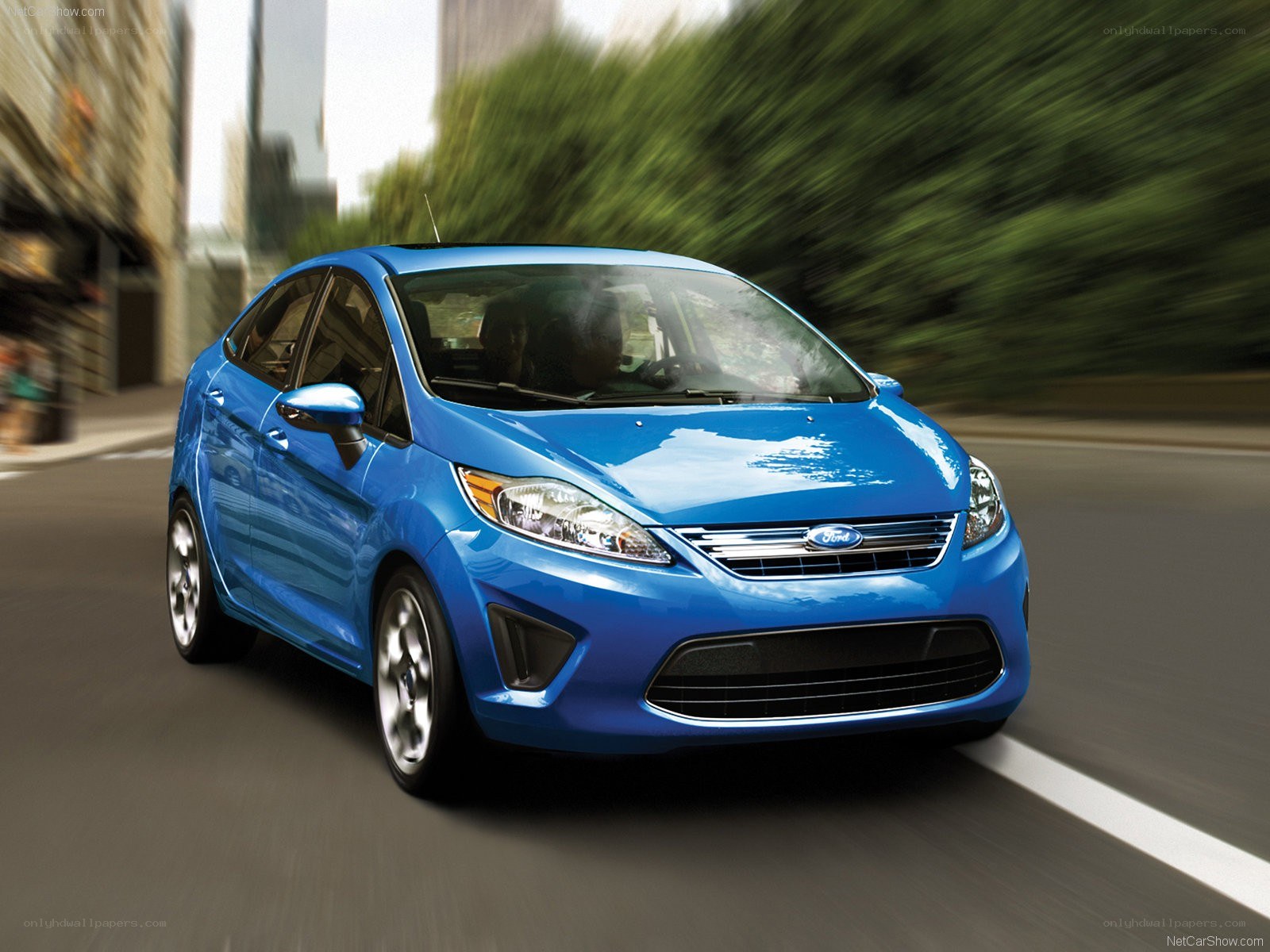 blue ford fiesta in motion