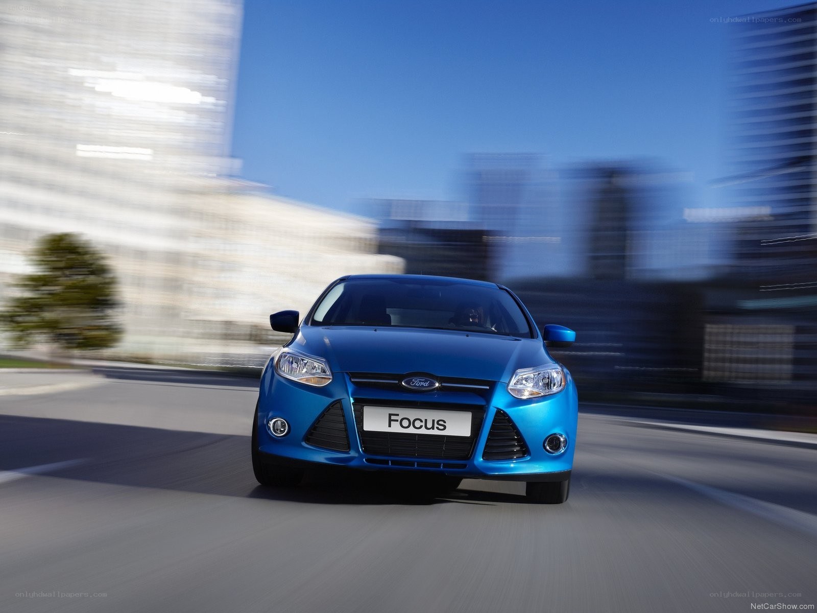 Blue Ford Focus in motion