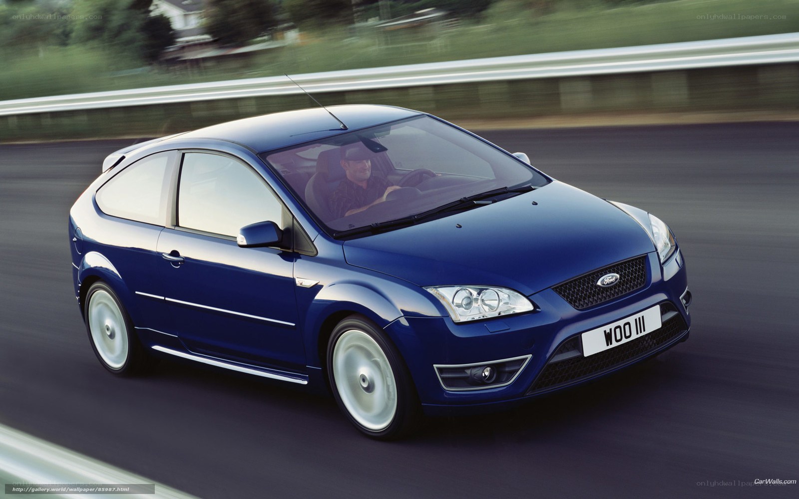 Blue Ford Focus in motion