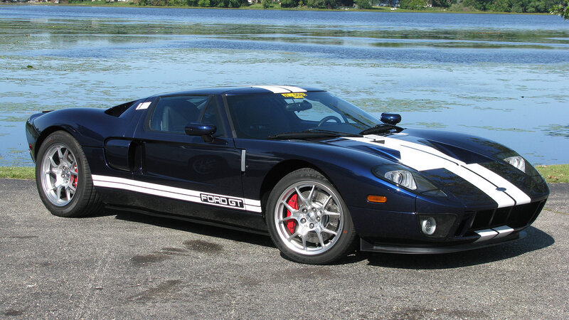 Blue Ford GT by a lake