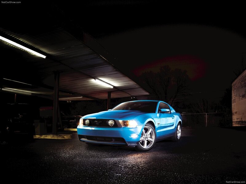 Blue Ford Mustang at night