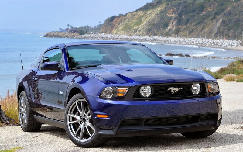 Blue Ford Mustang by the coast