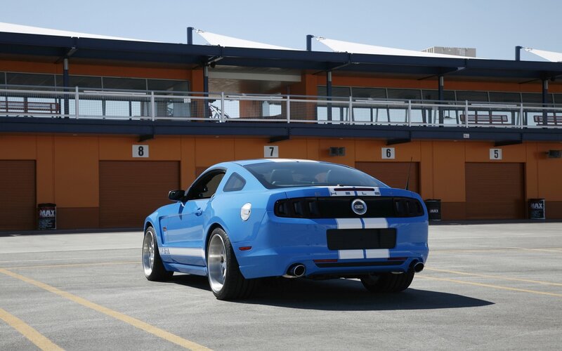 Blue Ford Mustang — Calm, Afternoon, Photograph, Race Track