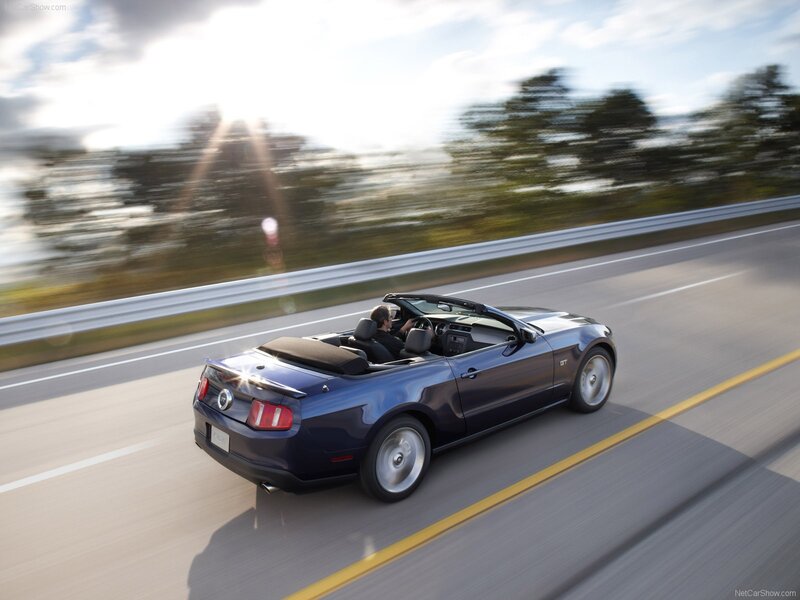 Blue Ford Mustang GT convertible driving
