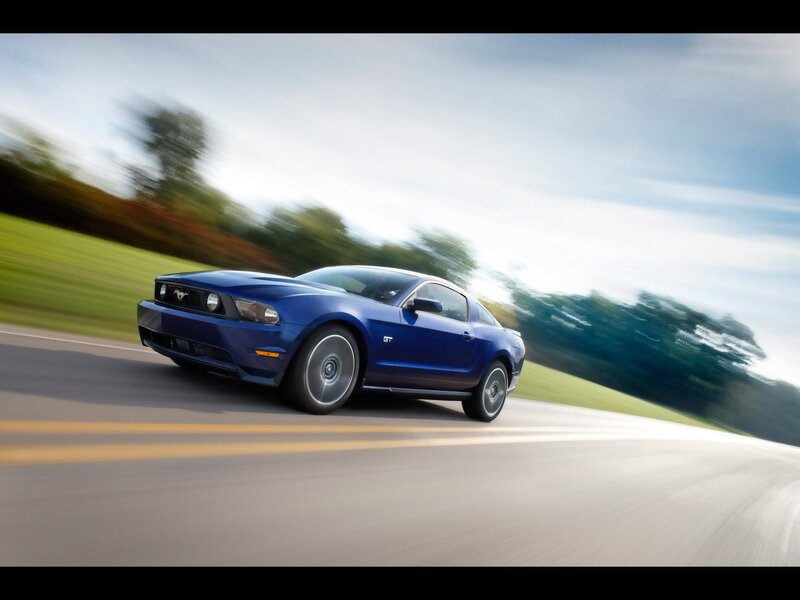 Blue Ford Mustang GT in motion